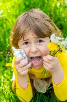 The child is allergic to dandelions. Selective focus. Kid.