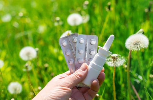 Allergy remedies in hands. Selective focus. Kid.