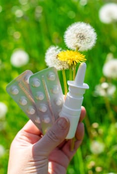 Allergy remedies in hands. Selective focus. Kid.