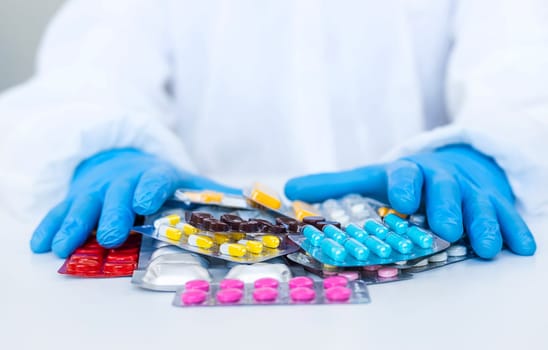 medicines in the hands of a doctor. Selective focus. pills.