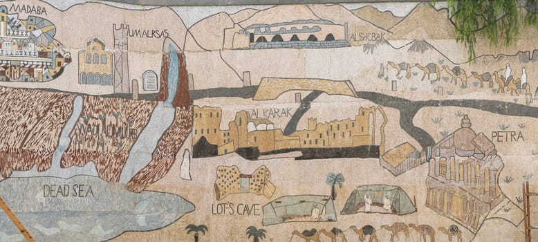 Wall mural showing outline map of Jordan historic sites including Dead Sea and Petra in Madaba