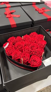 This stunning heart-shaped arrangement features vibrant red roses in an elegant black box, perfect for Valentine s Day, anniversaries, or any occasion to express your love.