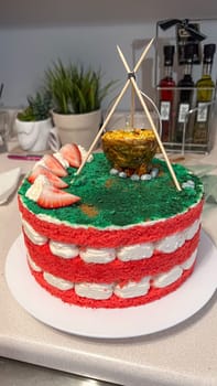 A whimsical cake inspired by campfire adventures. With red velvet layers and green frosting, it s perfect for birthdays or themed events, serving as a delightful treat for all occasions.