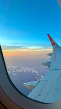 Ottawa, ON Canada - 10.01.2024: Aerial Vista of Sky and Clouds from Turkish Airlines Airplane Window at Sunrise, a Serene Travel Concept.