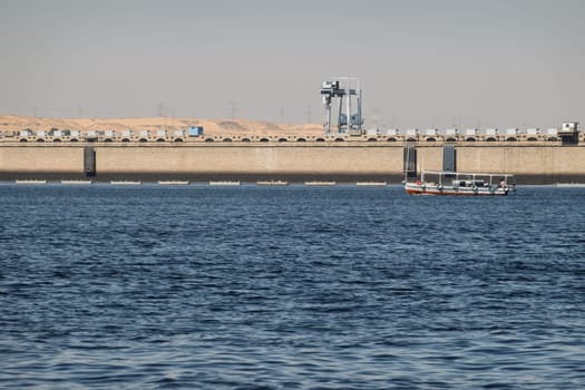 Single tour boats and ferries by the Old Aswan dam used to transport tourists to Philae Temple