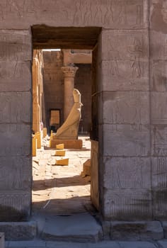 Detail of the carved statue of Horus outside the Pylon at the entrance of the massive temple in Edfu dedicated to Horus and Hathor