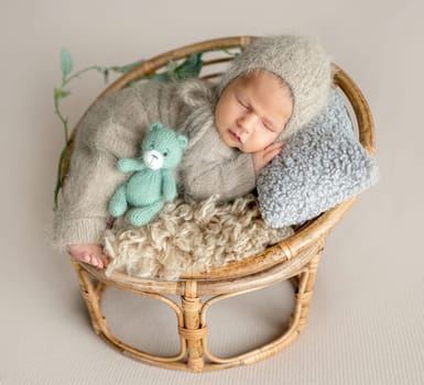 Newborn Baby Sleeping With A Smile In A Studio Photo