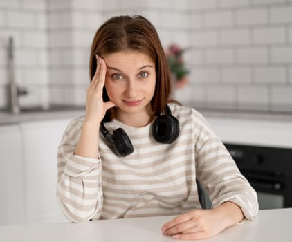 Teen Girl Wearing Headphones At Home