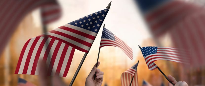 USA flags in their hands on a blurred urban background. The photo illustration was created without the use of artificial intelligence, only using Photoshop.