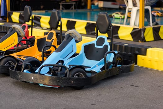 Go-kart racing action. Drivers prepare as go kart machines wait on the track for an adrenaline-fueled motorsport event.