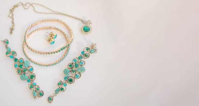 Set of beautiful green stone jewelry, banner, copy space at right.