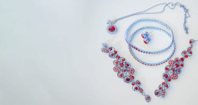 Set of fine jewelry, pink and blue toning, banner, copy space at left.