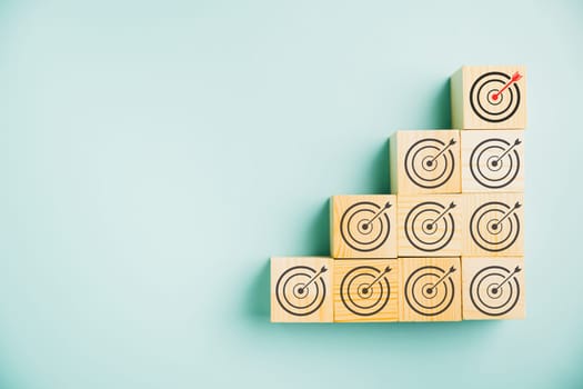 Contextual advertising and targeting concept showcased through wooden cubes with goal and contextual advertising icons. abstract nature of digital marketing strategy and social network advertising.