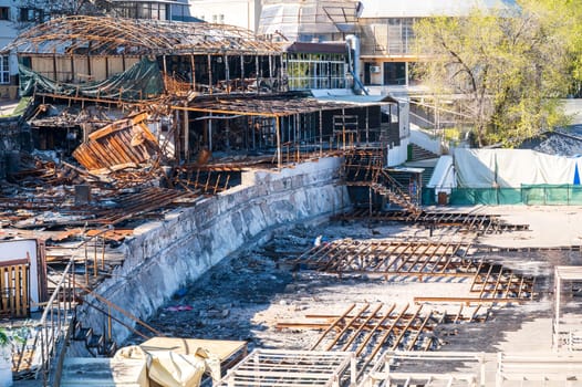 Damaged buildings after a fire. consequences of a fire in the city. Burnt metal structures. Burnt buildings of a restaurant, cafe or shopping center