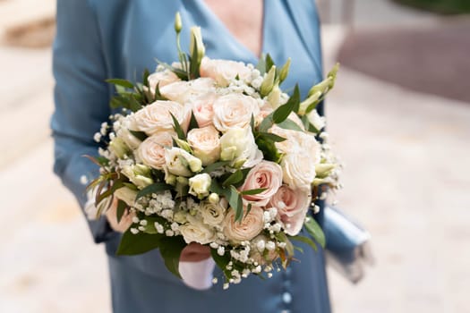 A bridal bouquet with roses, lisianthus, eucalyptus