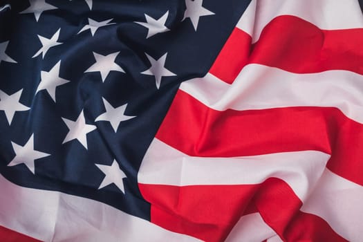 Red, white, and blue American flag with stars. The stars are in different sizes and are scattered across the flag