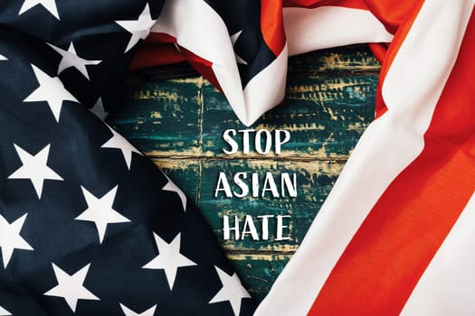 Heart made out of an American flag with the words Stop Asian Hate written underneath. The flag is red, white, and blue