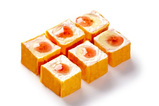 Delicious sushi rolls filled with cream cheese and exotic fruits, creating a sweet and unique culinary experience