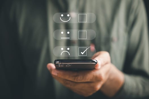 Unhappy client concept. Person holding smartphone showing one star rating. Expressing disappointment and sadness. Negative review, bad service, low satisfaction. dissatisfaction on business reputation