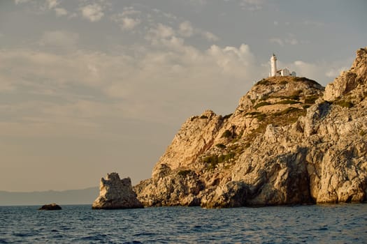 lighthouse on a high mountain at sunset. High quality photo