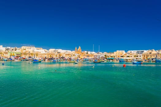 Cityscape of Marsaxlokk, a small coastal town in Malta.
