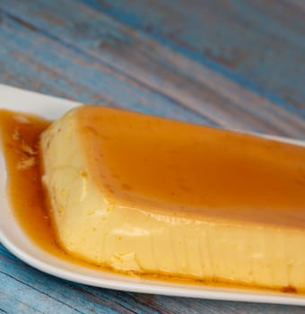 Cream caramel pudding with caramel sauce on a plate, Flan, High quality photo