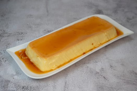 Cream caramel pudding with caramel sauce on a plate, Flan, High quality photo