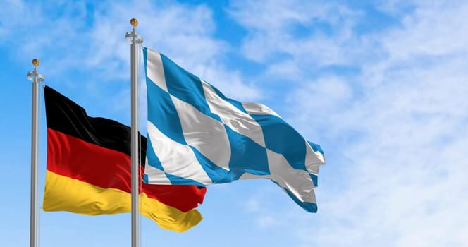 Bavarian flag waving with national german flag on a clear day. Bavaria is a state in the south-east of Germany. 3d illustration render. Selective focus. Fluttering fabric.