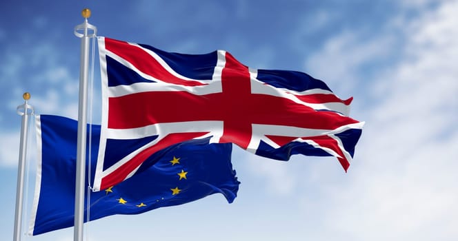 Flags of United Kingdom and the European Union waving in the wind. 3d illustration render. Selective focus