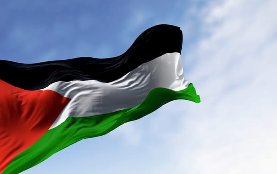 Palestine national flag waving on a clear day. Three black, white, green stripes with red triangle on left. 3d illustration render. Selective focus. Close-up. Rippling fabric. Selective focus