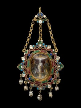 Ornate 17th-century pendant from Sicily, Italy, depicting the Crucifixion. Features intricate goldwork, vibrant enamel, gemstones, and pearl drops. Evokes historical piety and fine craftsmanship.