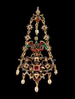 Ornate Renaissance Revival pendant in the form of a phoenix, crafted in Sicily during the first half of the 17th century. Features intricate gold filigree, vibrant enamel, rubies, sapphires, and delicate pearl drops.