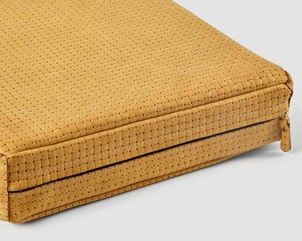 Mustard yellow woven leather bag showcasing its unique texture and meticulous craftsmanship