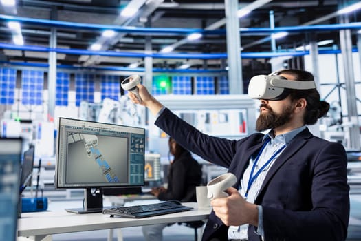 Photovoltaics factory technician using VR goggles to do performance testing of solar panel designs. Employee improving existing solar panel configurations for cost reduction using virtual reality