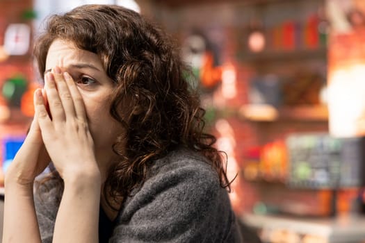 Stock trader devastated about a stock exchange scam and losing money, feeling depressed and worried about her bankruptcy. Sad upset woman looking at market trends go downward on pc.