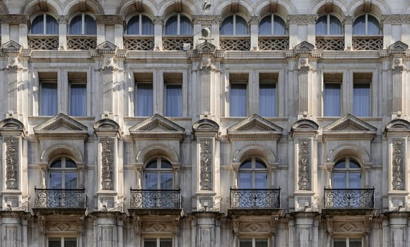 London, UK - May 13, 2025 - A stunning European style of Wrought iron black railings balconies and Classic glass windows in residential tenement building with London victorian architecture. use it as your Wallpaper, Poster and Space for text, Selective focus.