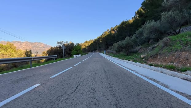 A beautiful, winding road in the majestic mountains, showcasing stunning and breathtaking natural landscapes