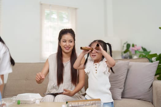 A joyful scene showing a mother and child crafting together, strengthening bonds while promoting environmental awareness through fun and sustainable practices.