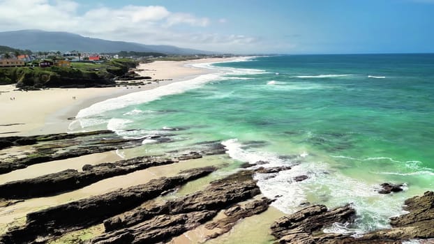 Experience breathtaking beach scenery that features vibrant, lush greenery, rolling waves, and a serene coastline