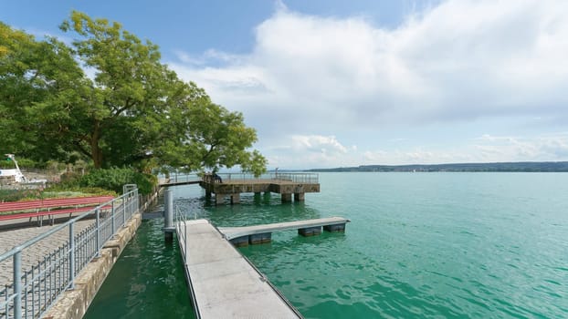 Boat landing stage on the Uberlingen promenade with a view of Lake Constance