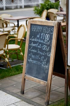 Display advertising a selection of soft drinks and alcohol at a bar in Swinoujscie, Poland