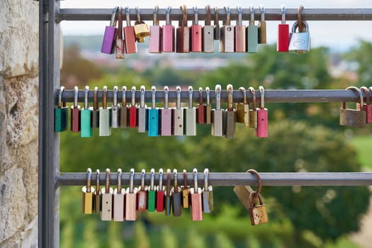 Love locks as a symbol of eternal love on a fence at the Petersberg Citadel in Erfurt
