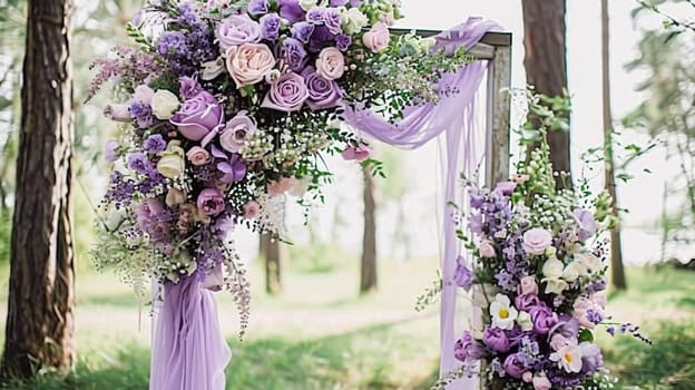 A floral archway adorned with purple lavender flowers, set up for a wedding ceremony in a garden