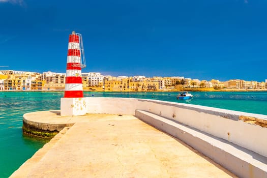 Lighthouse on the pier in Birzebbuga, Malta.