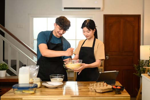 Romantic couple couple prepares breakfast in warm kitchen.