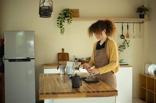 Modern lifestyle and homemade brewing barista style coffee preparation at home.