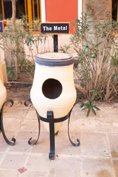 Decorative recycling bin for metal waste collection in an outdoor public area. Eco-friendly design illustrating environmental responsibility and proper waste sorting management efforts