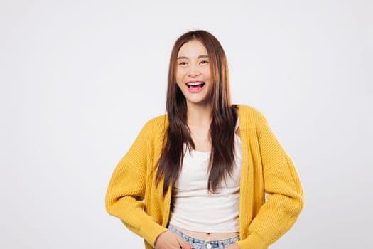 Laugh with joy laugh with confidence as a happy Asian woman enjoys a fun and expressive moment isolated on a white background with peaceful and cheerful energy, World Laughter Day
