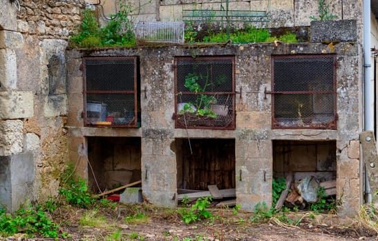 An abandoned rabbit hutches on a farm