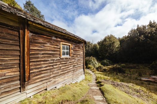 Iconic Du Cane Hut built by Patrick Joseph ‘Paddy’ Hartnett on the Overland Track is the oldest structure in the area. Photographed on a warm autumn morning in Cradle Mountain, Tasmania, Australia